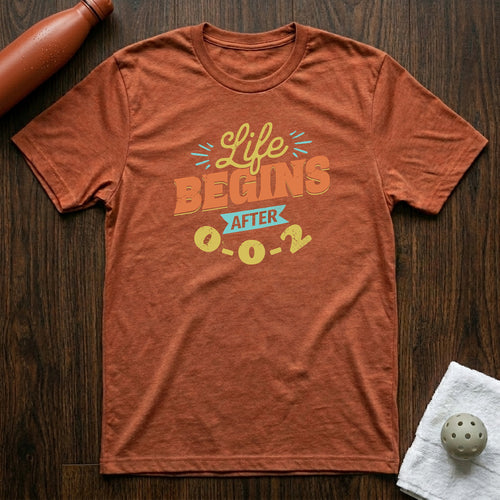 Life Begins After 0-0-2 Pickleball T-Shirt in Heather Clay